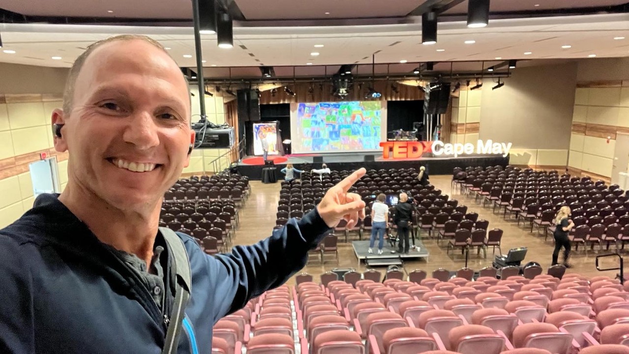 Kevin pointing at the TEDx Cape May stage