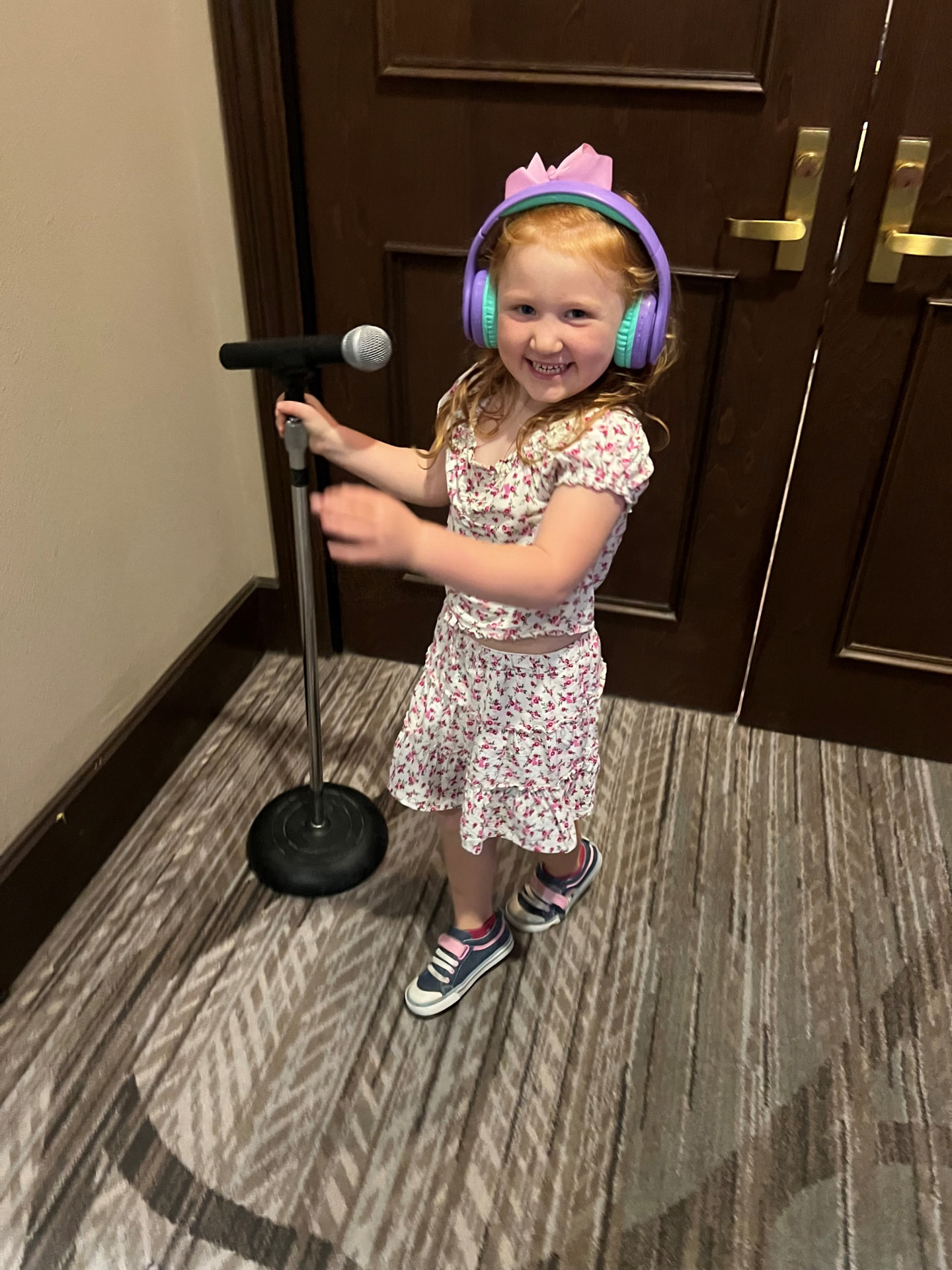 Kevin's daughter playing speaker with a microphone