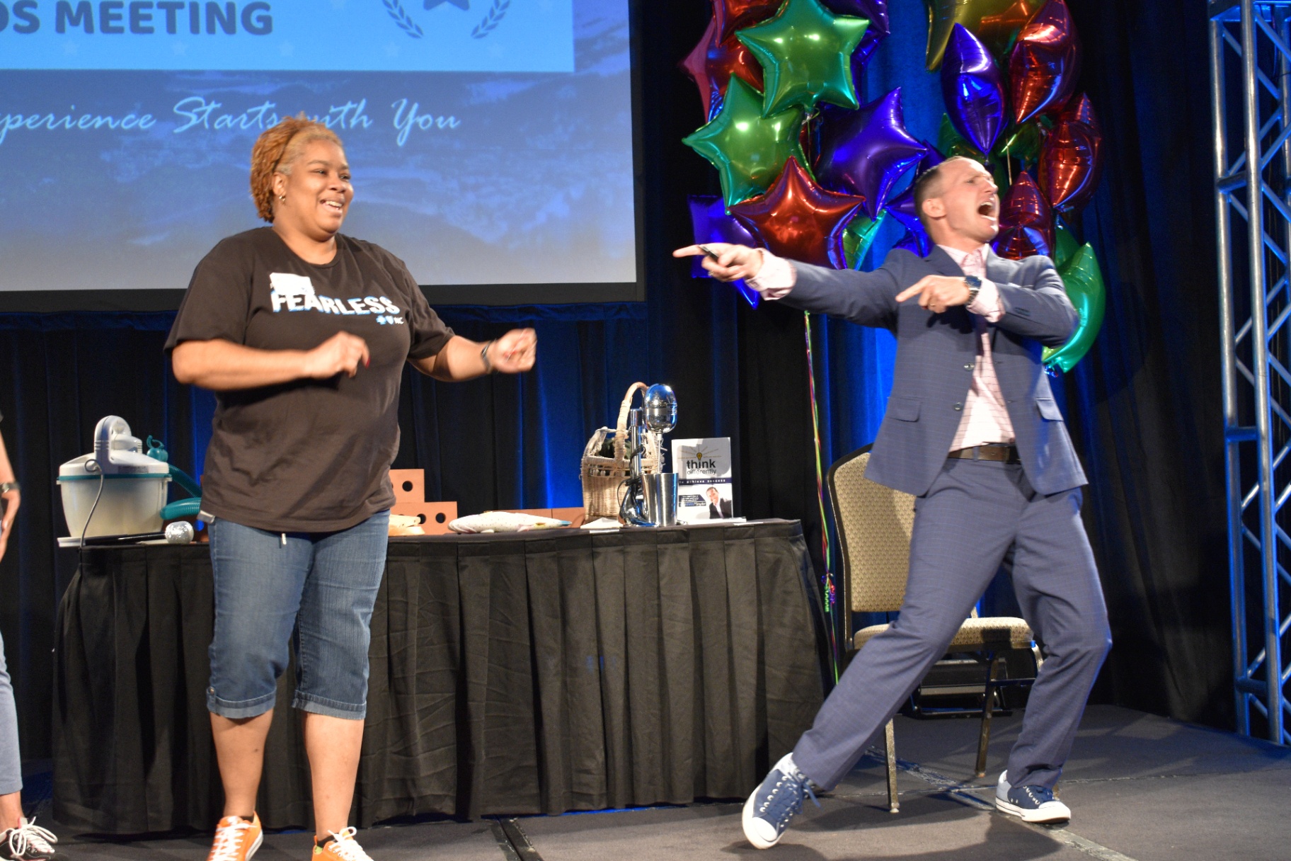 Dr. Kevin C. Snyder engaging an audience member on stage — Ripple-Minded Leadership in action